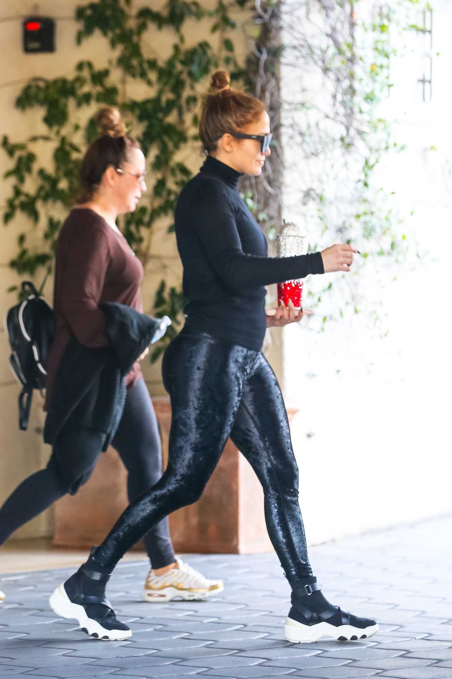Jennifer Lopez in a Blue Satin Gym Pants Leaves Her Hotel