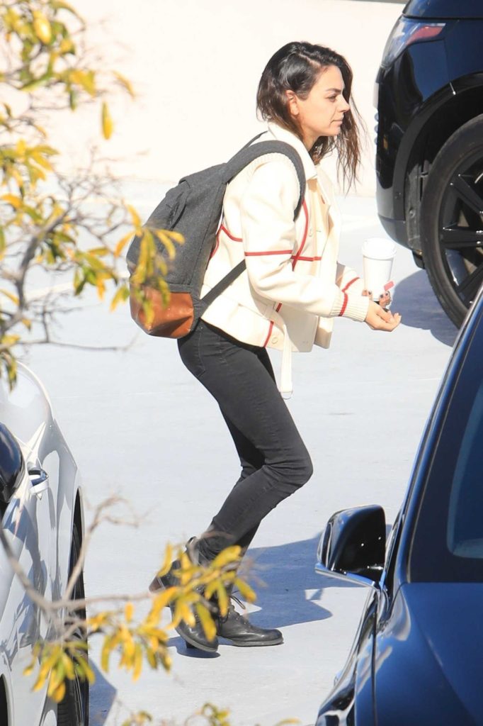 Mila Kunis in a Black Boots