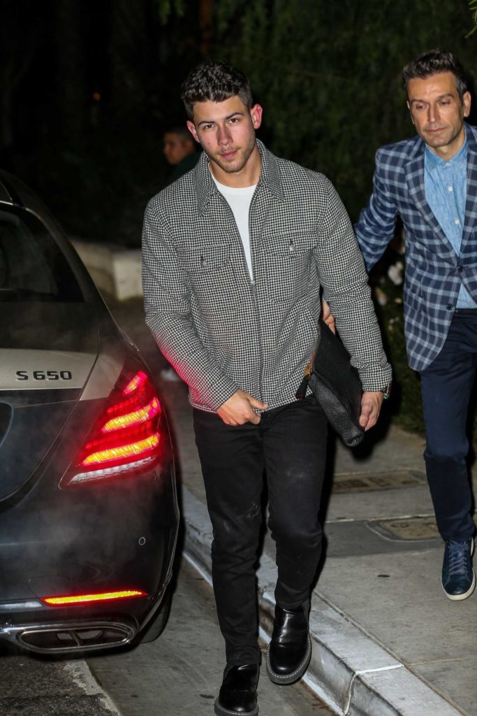 Nick Jonas in a Gray Jacket
