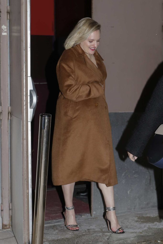 Elisabeth Moss in a Beige Coat