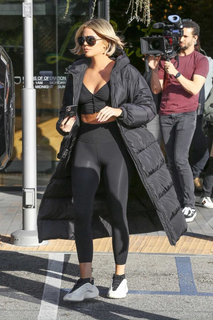 Khloe Kardashian in a Black Puffer Coat