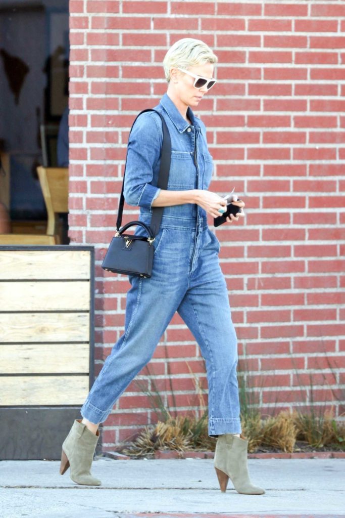 Charlize Theron in a Denim Jumpsuit