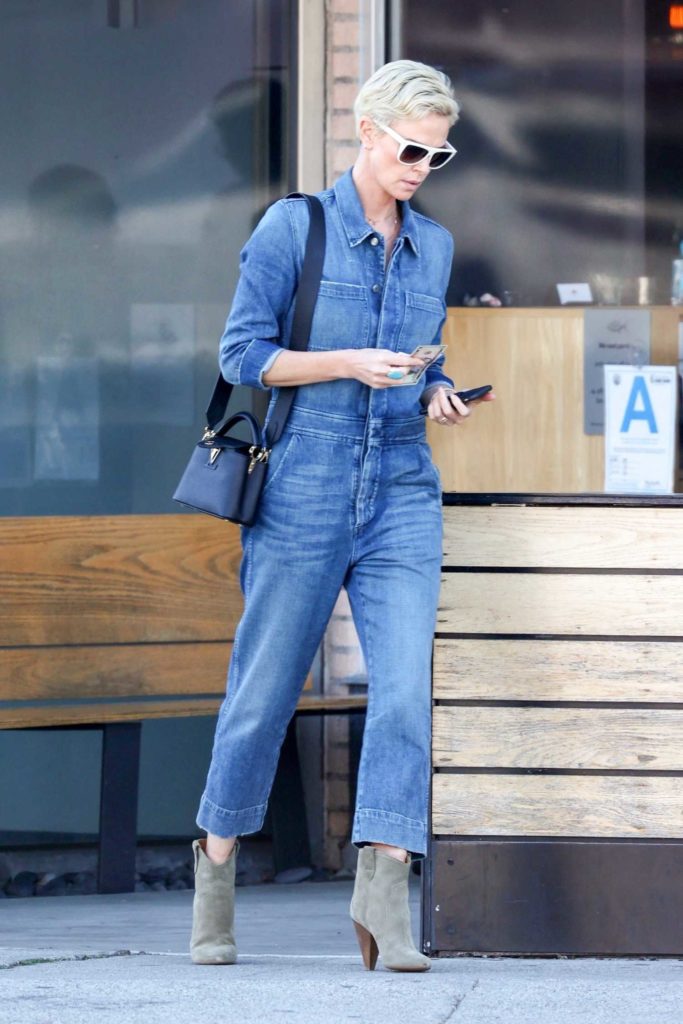 Charlize Theron in a Denim Jumpsuit