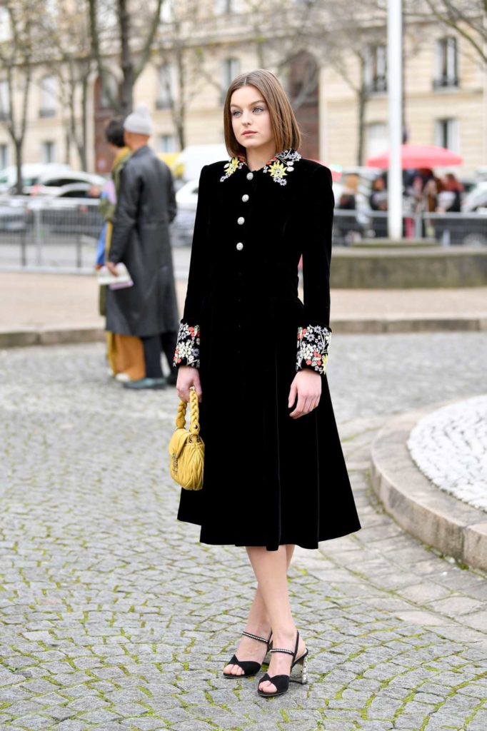 Emma Corrin in a Black Dress