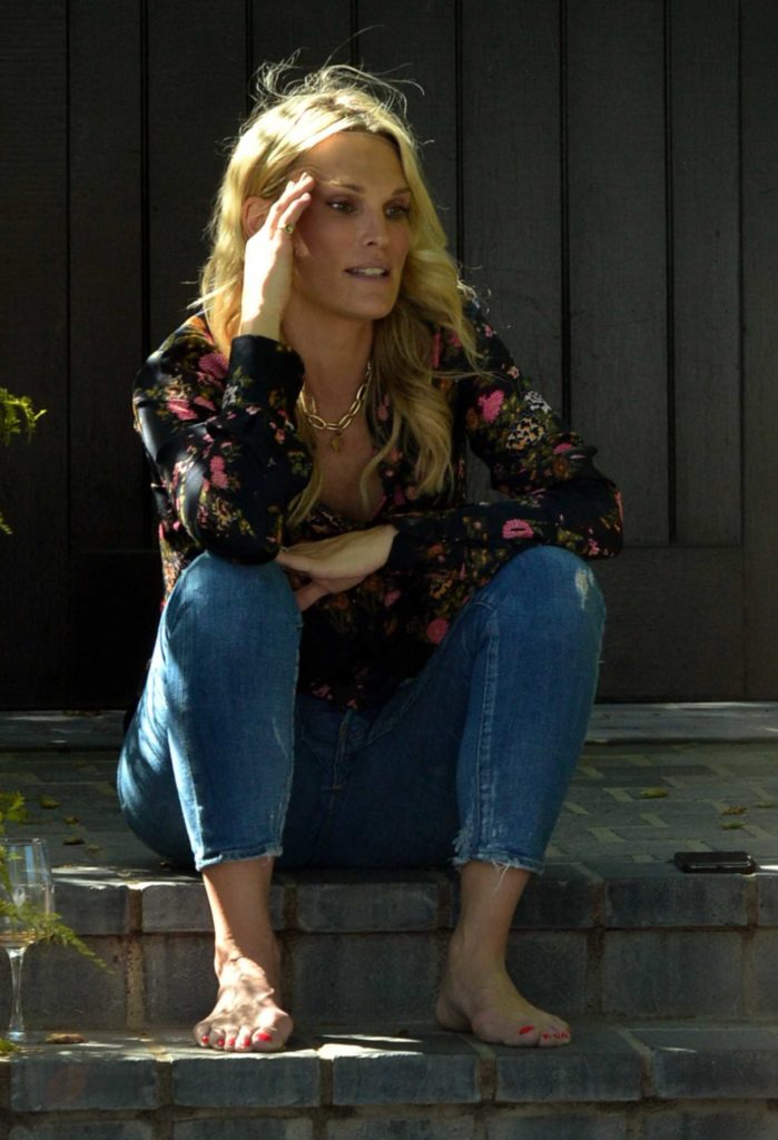 Molly Sims in a Black Floral Blouse