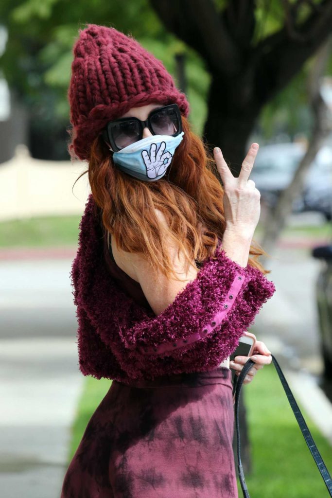 Phoebe Price in a Surgical Face Mask
