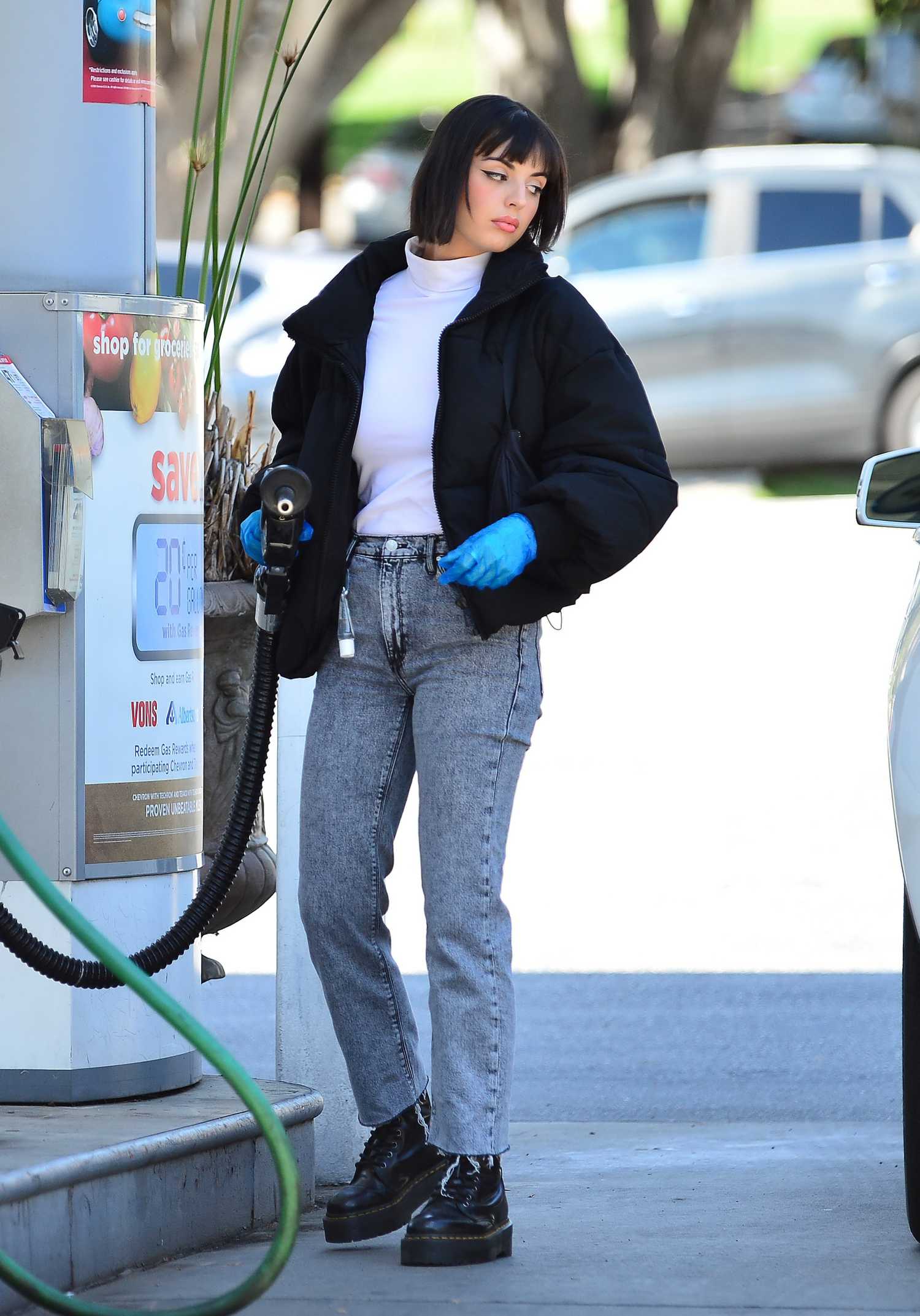 Rebecca Black in a Bright Blue Latex Gloves Pumps Gas in Los Angeles ...