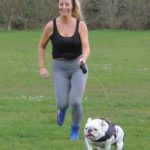 Danielle Mason in a Black Tank Top Walks Her Dog in the Park During the COVID-19 Lockdown in London