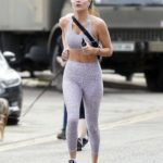 Emily Blackwell in an Animal Print Workout Clothes Goes Out for a Jog in London