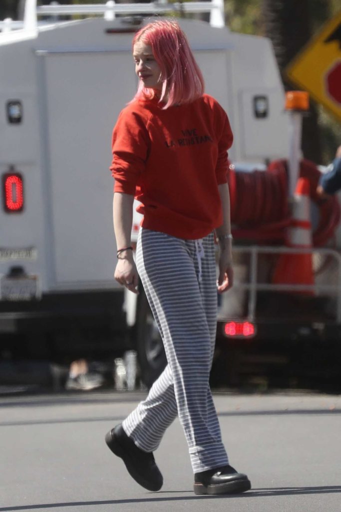 Esther McGregor in a Red Sweatshirt