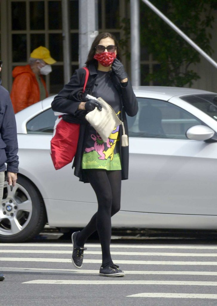 Famke Janssen in a Red Face Mask