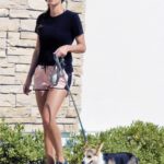 Becca Kufrin in a White Cap Walks Her Dog Mino in Los Angeles