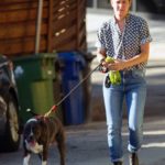 Bianca Butti in a Blue Jeans Walks Her Dog in Los Angeles
