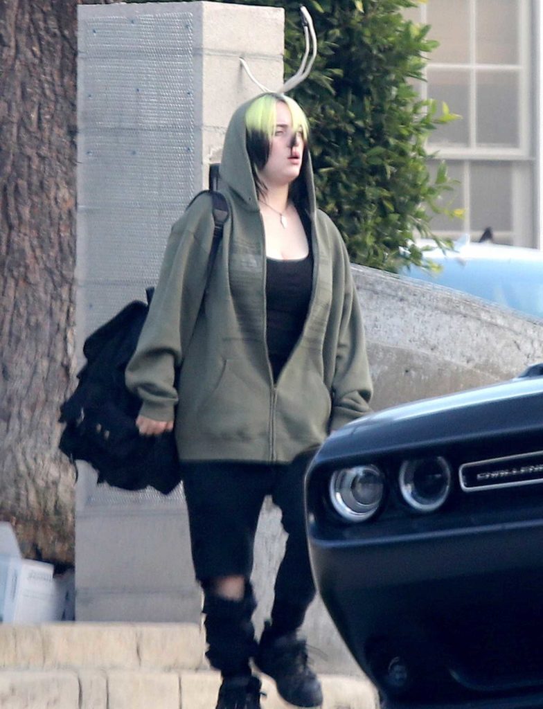 Billie Eilish in a Black Ripped Jeans
