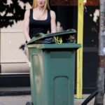 Caprice in a Denim Shorts Takes Out the Bin During the COVID-19 Lockdown in London
