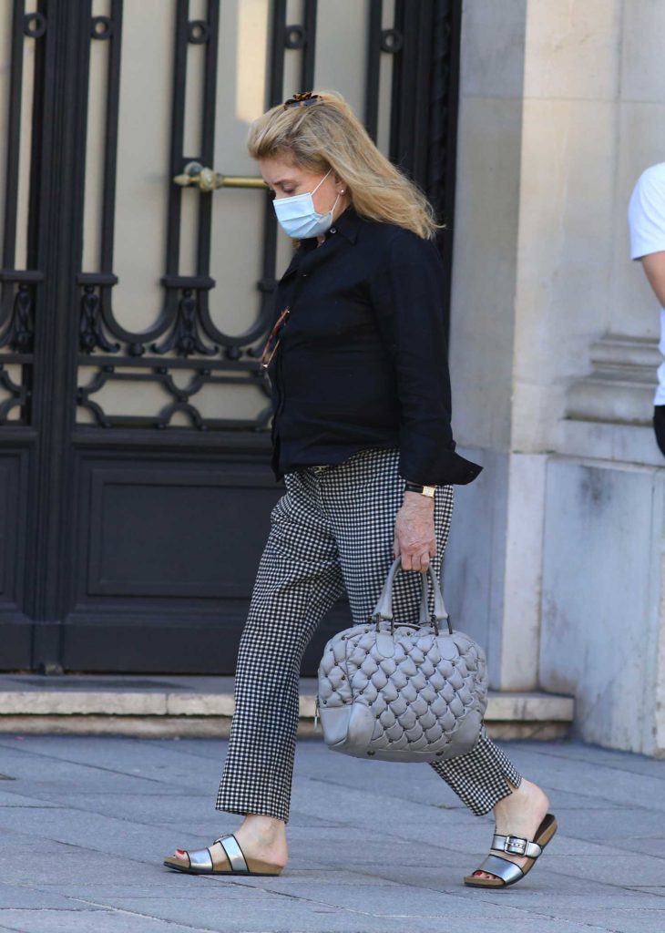 Catherine Deneuve in a Protective Mask