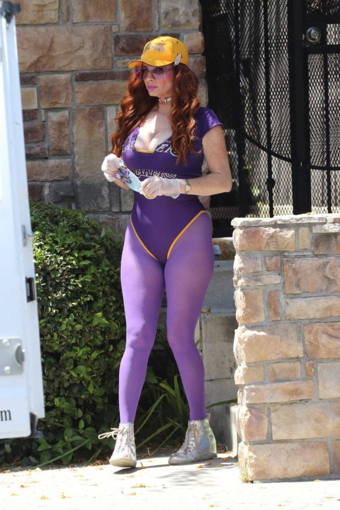 Phoebe Price in a Purple Swimsuit