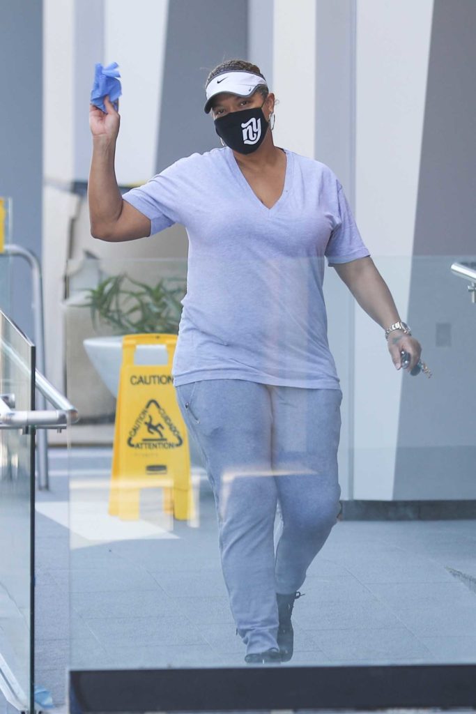 Queen Latifah in a Black Protective Mask