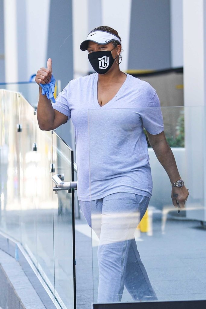 Queen Latifah in a Black Protective Mask