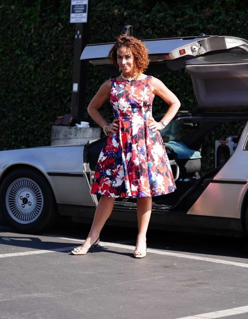 Claudia Wells in a Floral Dress
