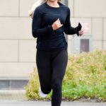 Molly Smith in a Black Cap Heading Off for a Jog with in Manchester