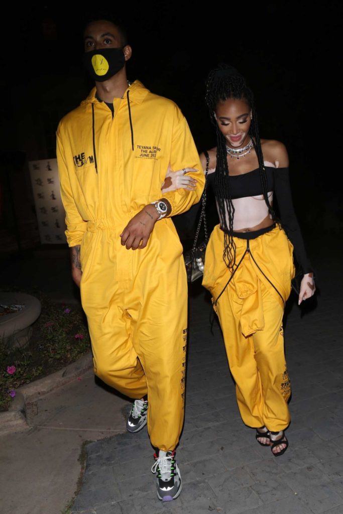 Winnie Harlow in a Yellow Jumpsuit