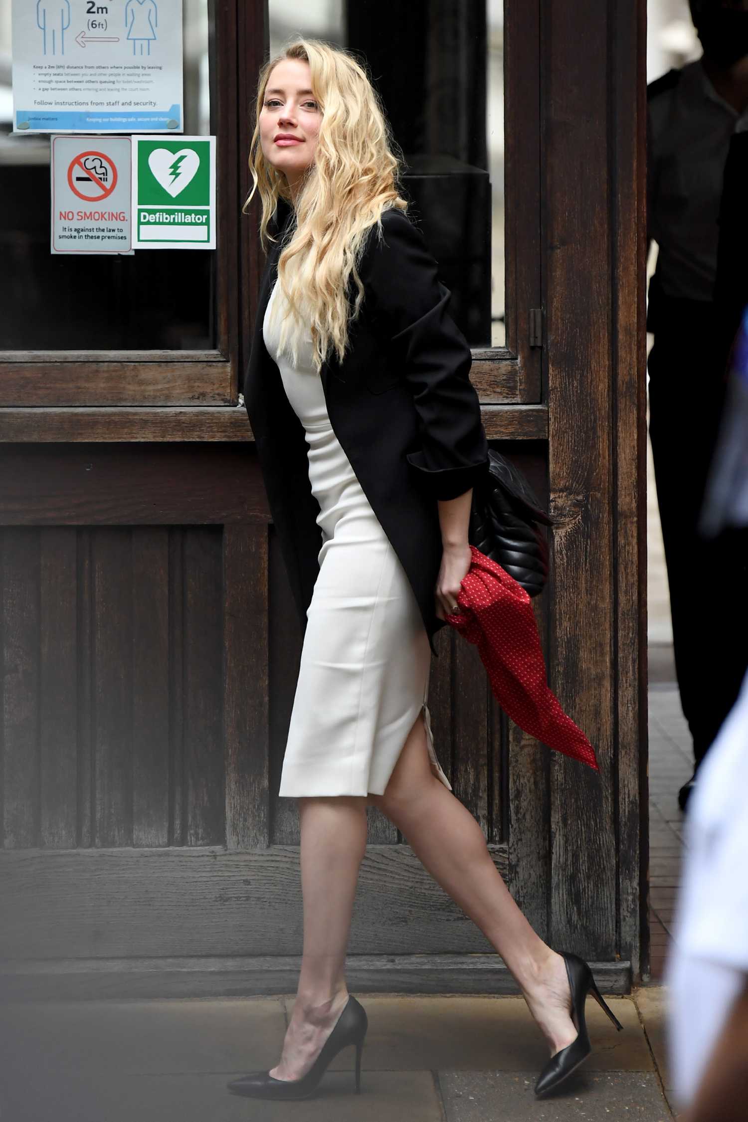 Amber Heard in a White Dress Arrives at the Royal Courts of Justice in
