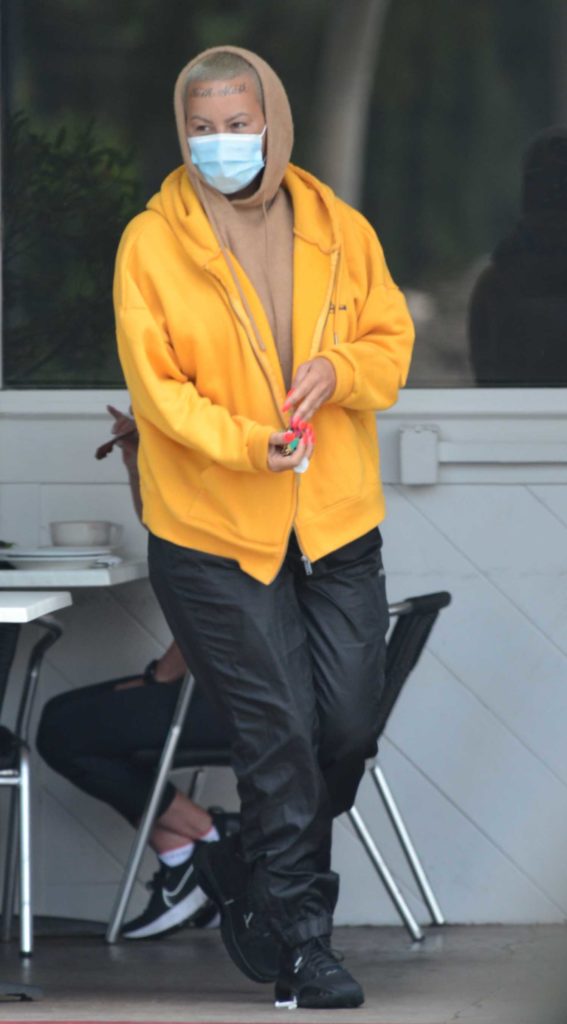 Amber Rose in a Yellow Track Jacket