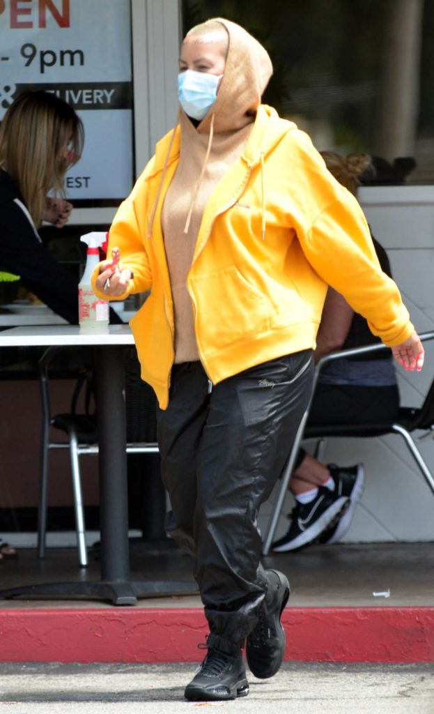 Amber Rose in a Yellow Track Jacket