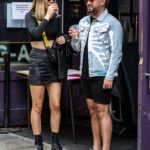 Demi Sims in a Short Black Skirt Was Seen Out with Dean Rowland in Soho Square in London