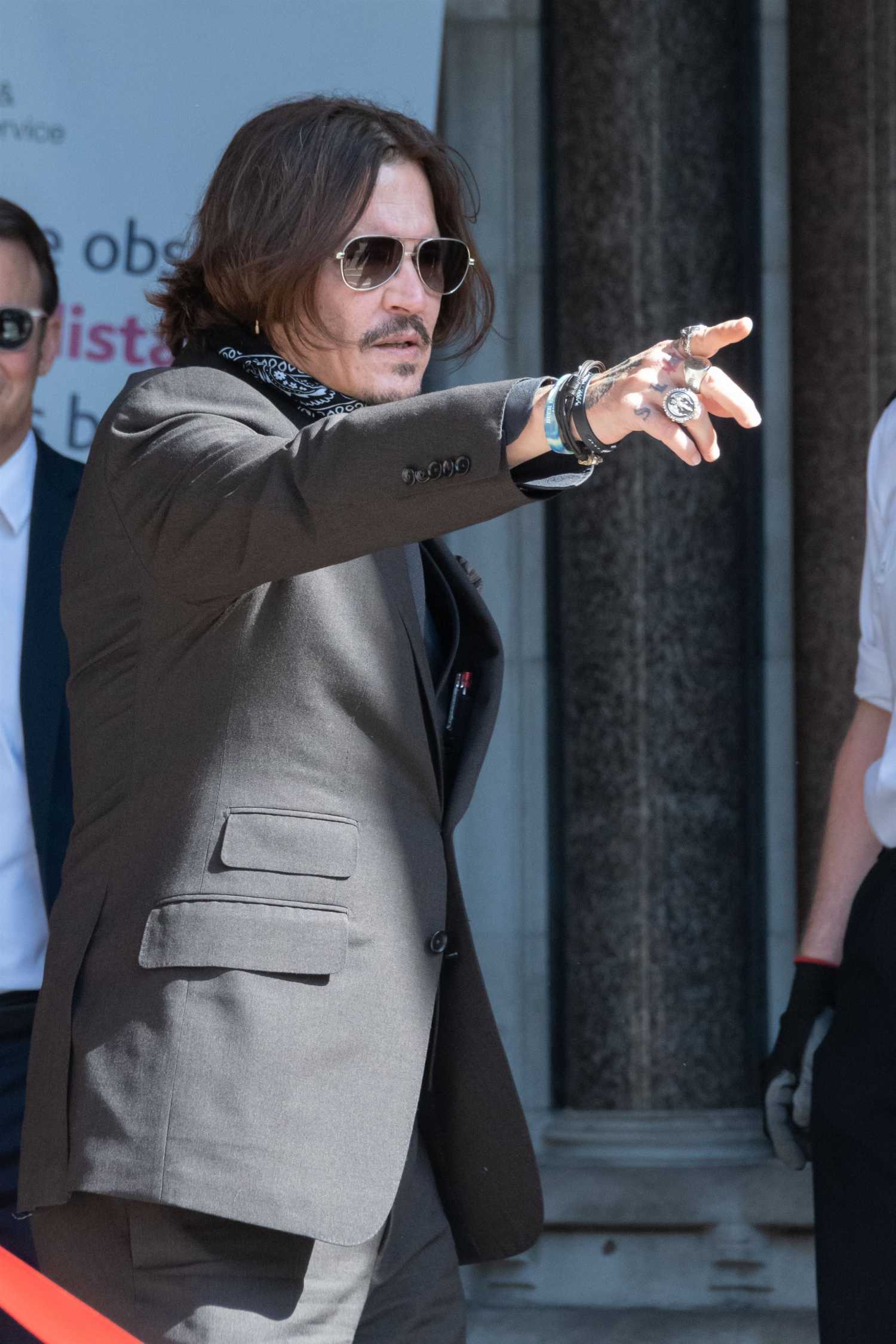 Johnny Depp in a Gray Suit Arrives at the Royal Courts of Justice in