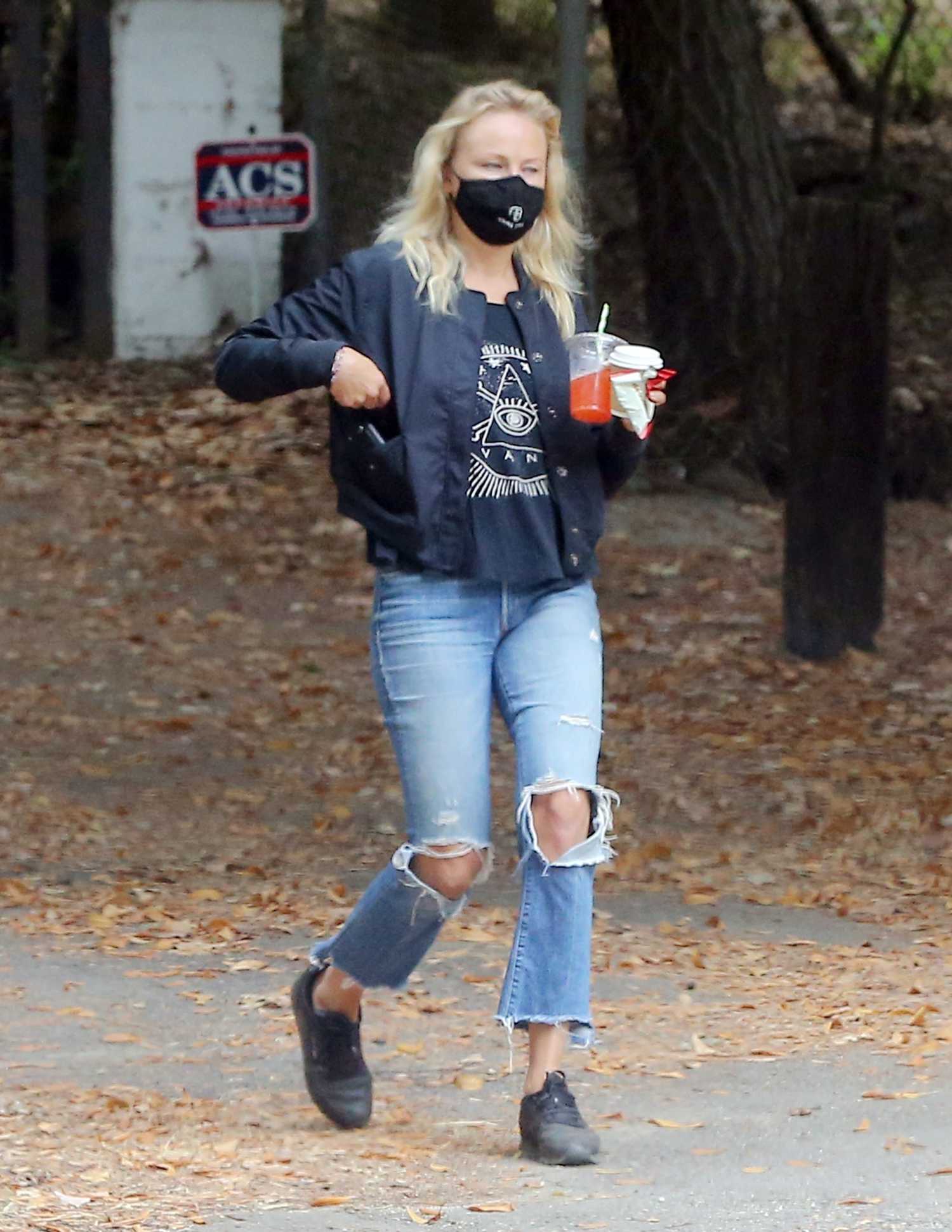Malin Akerman in a Blue Ripped Jeans Takes a Morning Walk Around ...
