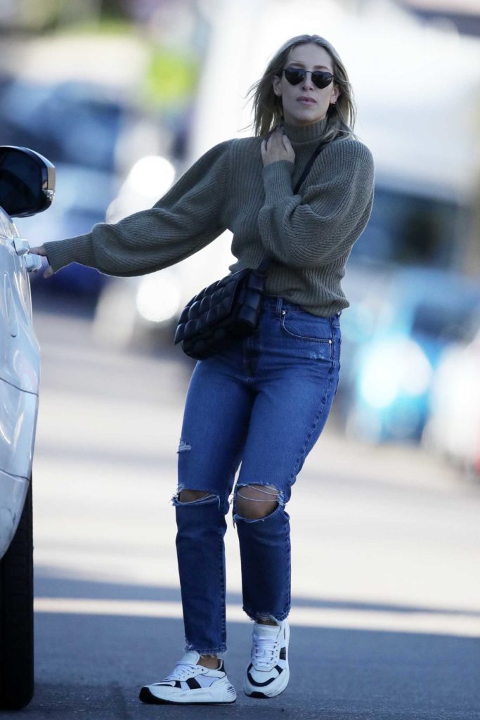 Phoebe Burgess in a Blue Ripped Jeans