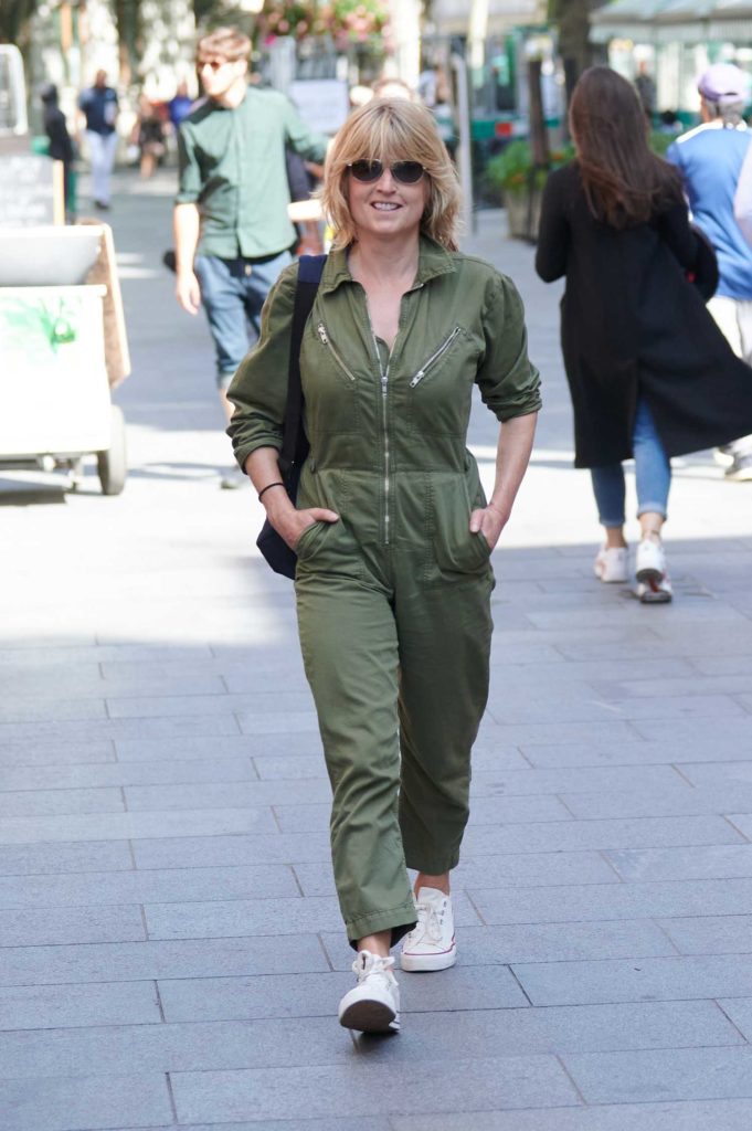 Rachel Johnson in a Green Jumpsuit