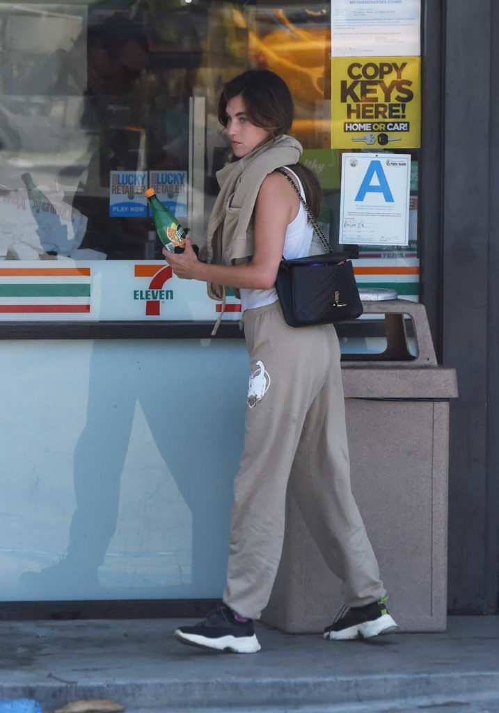 Rainey Qualley in a White Tank Top