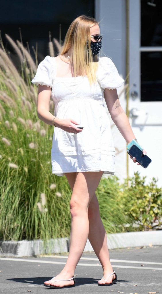 Sophie Turner in a White Dress