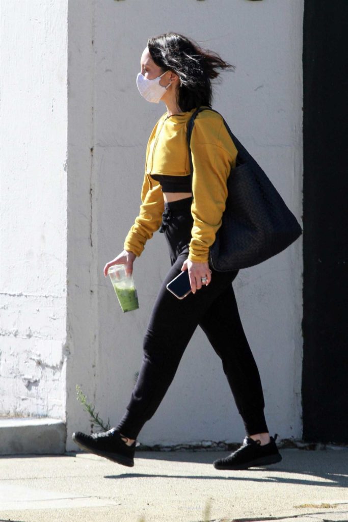 Cheryl Burke in a Yellow Cropped Track Jacket