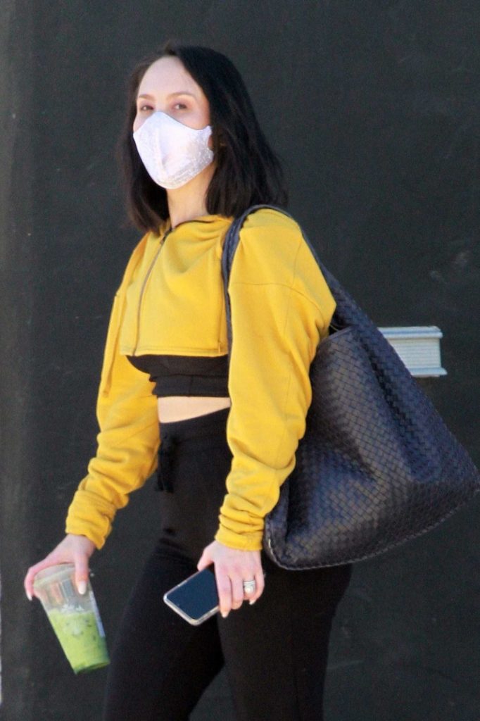 Cheryl Burke in a Yellow Cropped Track Jacket