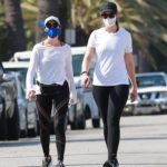 Christina Schwarzenegger in a Black Cap Goes Out for a Walk with a Friend Around Her Neighborhood in Santa Monica