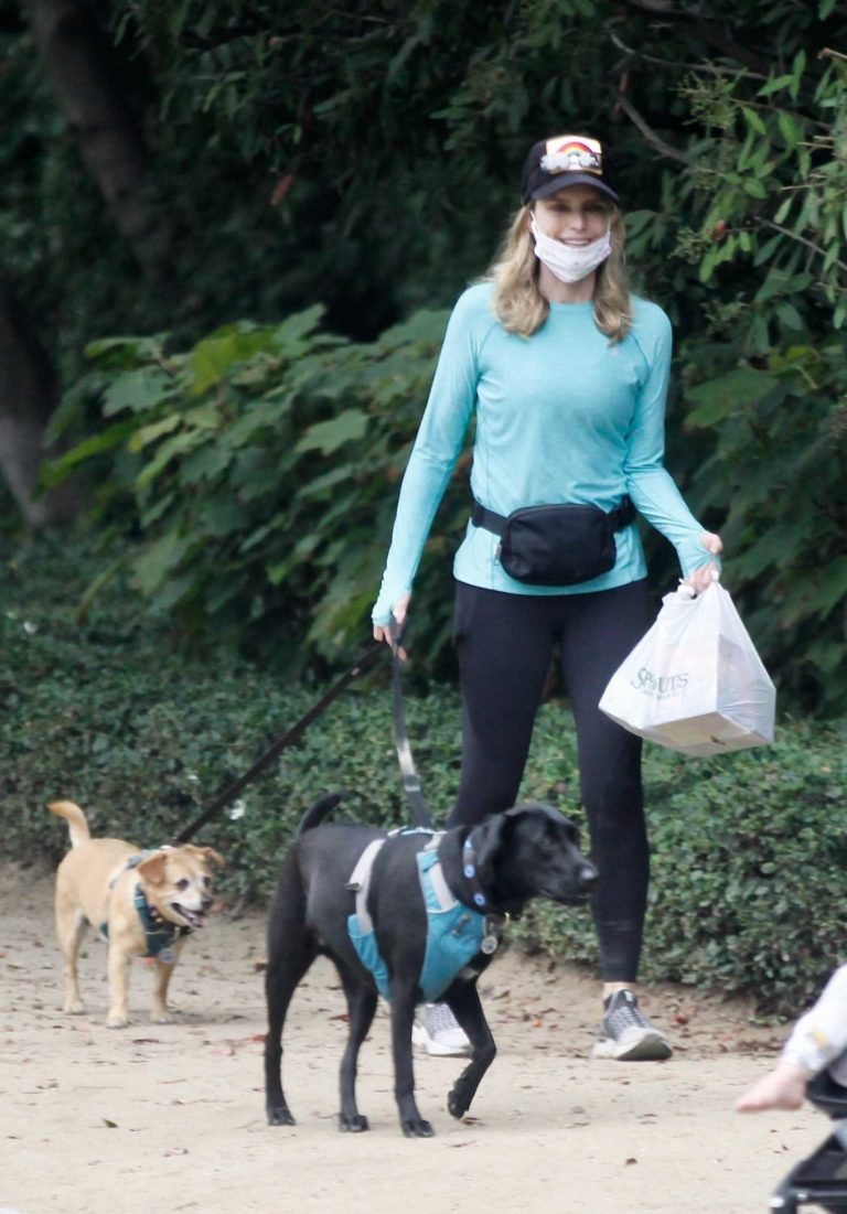 Courtney Thorne-Smith in a Black Leggings Walks Her Dogs in Brentwood
