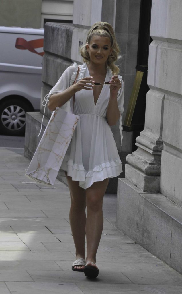 Molly Smith in a White Mini Dress