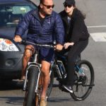Arnold Schwarzenegger in a Blue Jacket Does a Bike Ride Out with Christina Schwarzenegger in Brentwood