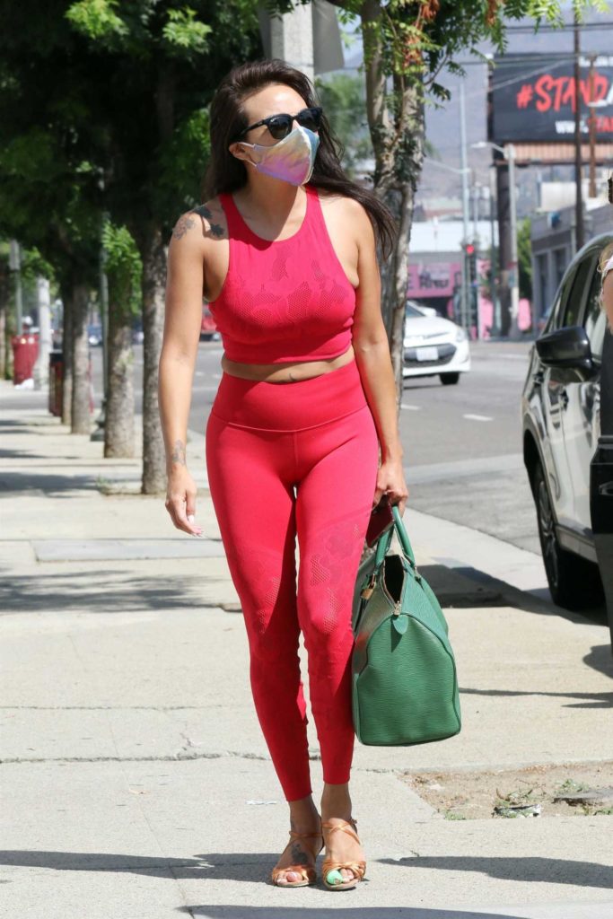 Jeannie Mai in a Red Workout Ensemble