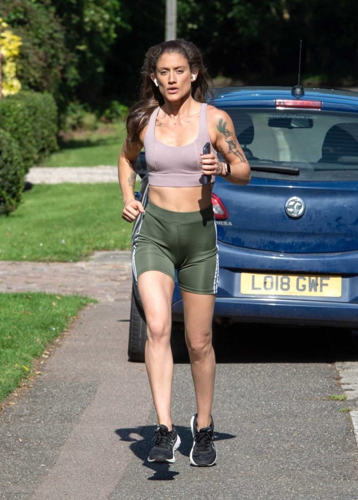 Katie Waissel in a Green Spandex Shorts