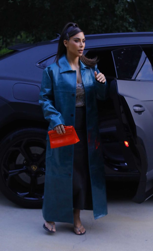 Kim Kardashian in a Blue Leather Trench Coat