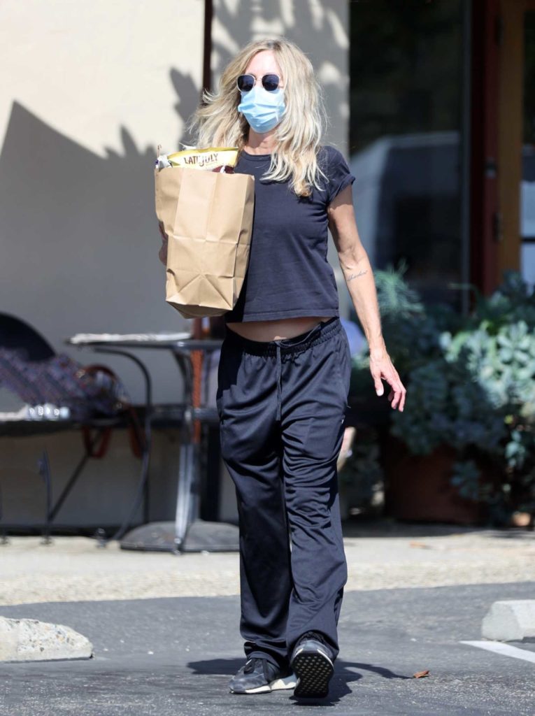 Meg Ryan in a Protective Mask