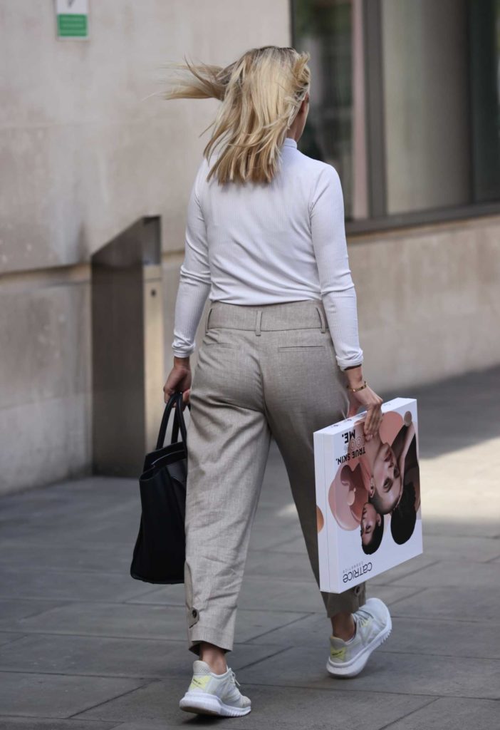 Mollie King in a White Turtleneck