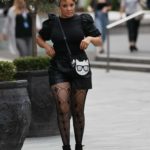 Pandora Christie in a Black Blouse Arrives at the Heart Radio in London