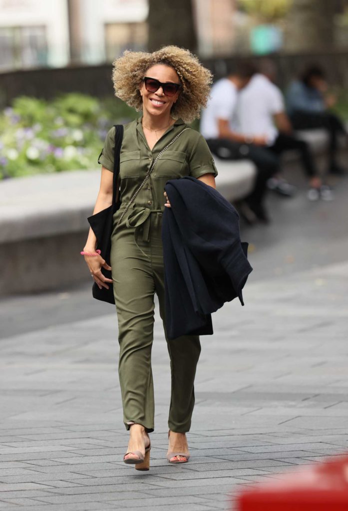 Ria Hebden in an Olive Jumpsuit