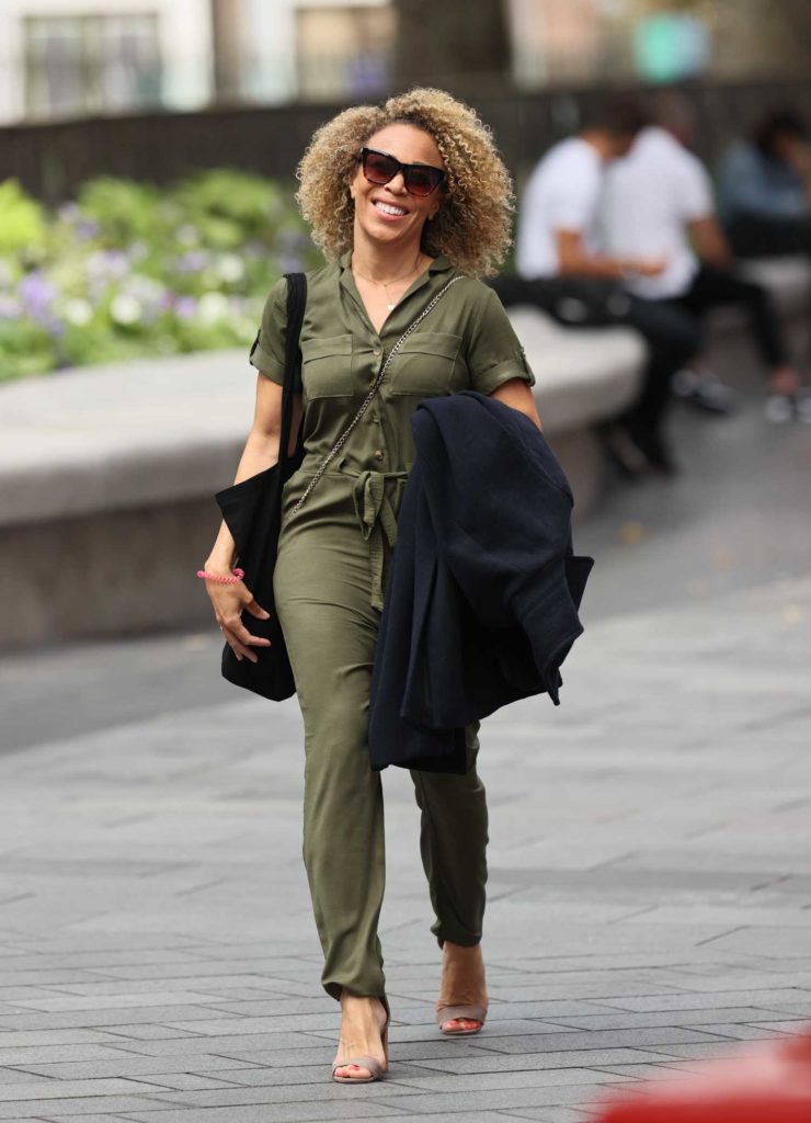 Ria Hebden in an Olive Jumpsuit